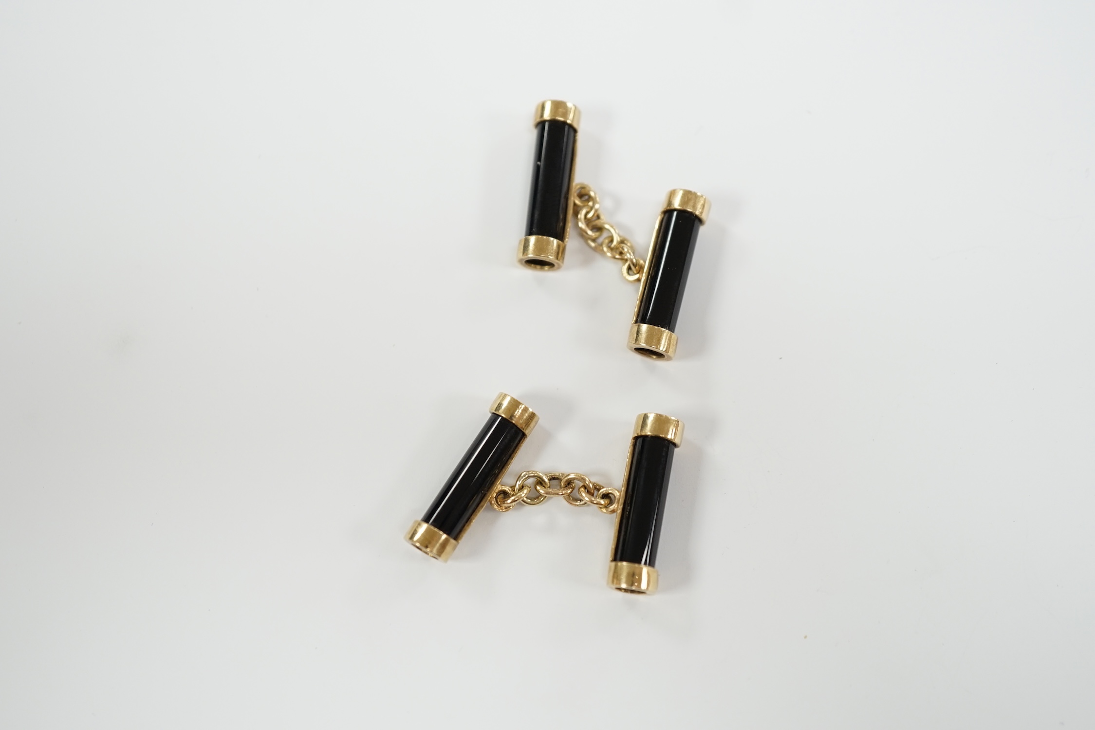 A pair of 9ct gold and black onyx baton shaped cufflinks, 22mm, gross weight 9.5 grams.